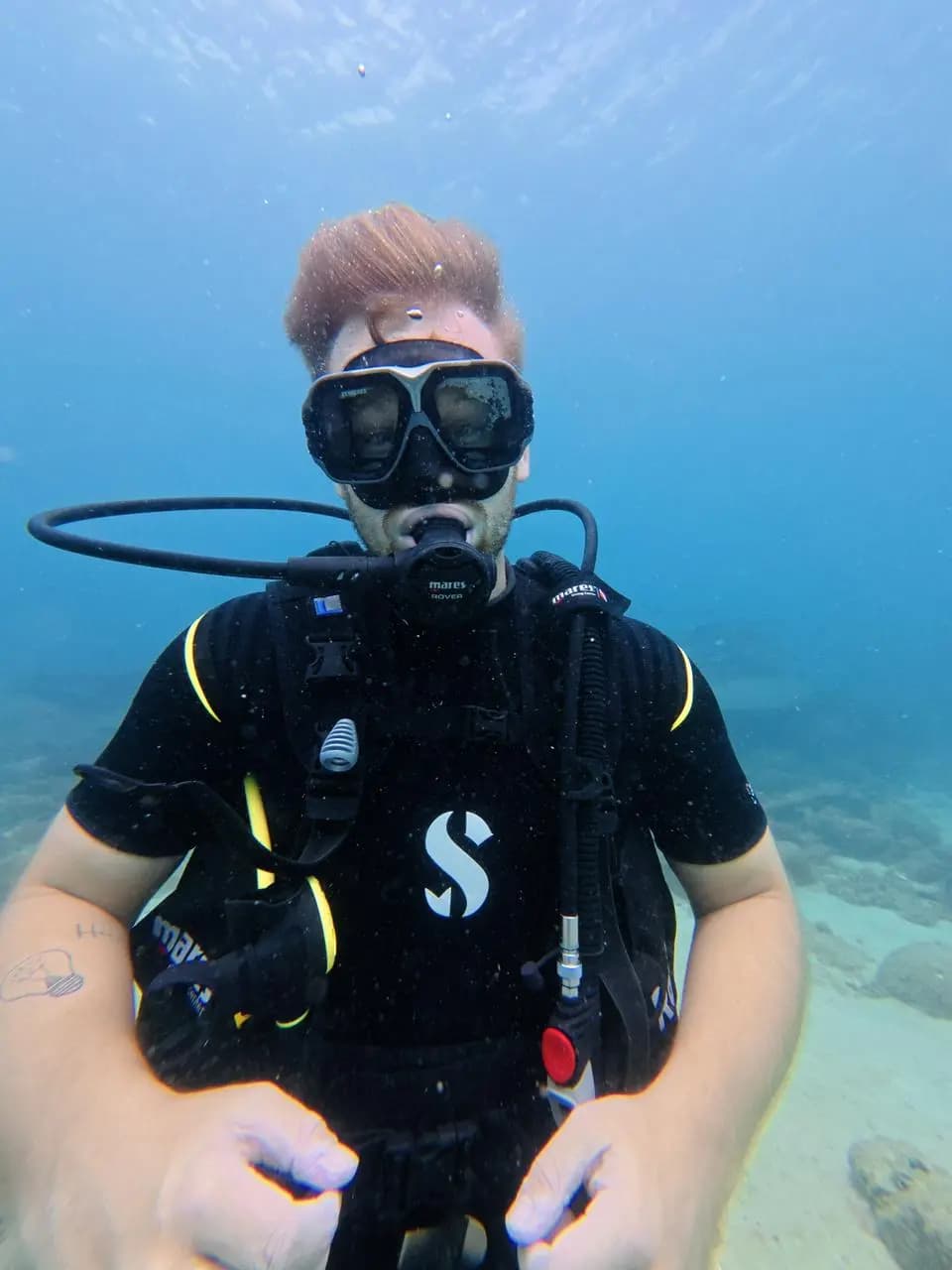 Beginner scuba diver in the clear waters of Trincomalee, Sri Lanka